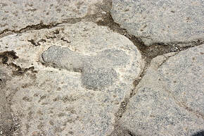 Sign pointing to a brothel in Pompeii