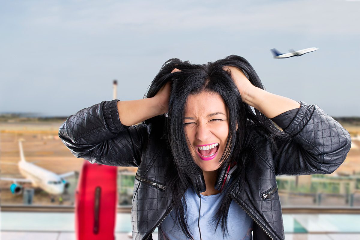 Airlines_Bad_Service_Frustration_80693140_XWEBL Frustrated airline passenger