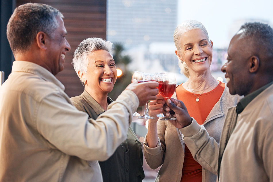 Group celebrating a birthday with wine