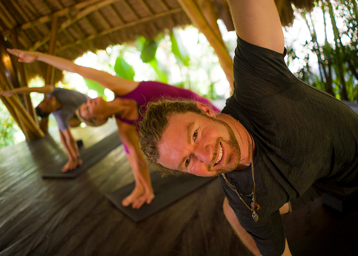 Spa Retreat_320327602_XWEB Yoga stretches at a wellness retreat